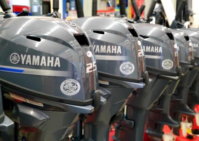 Yamaha outboards in varying sizes, lined up on display.